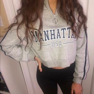 A cropped long sleeve top